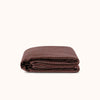 Folded brown striped duvet cover against a white background