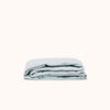 A folded fitted sheet in Turkish Blue color, displayed against a white background.